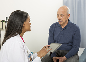 Man talking to health care provider.