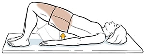 Woman lying on back pushing on feet to raise hips off the floor